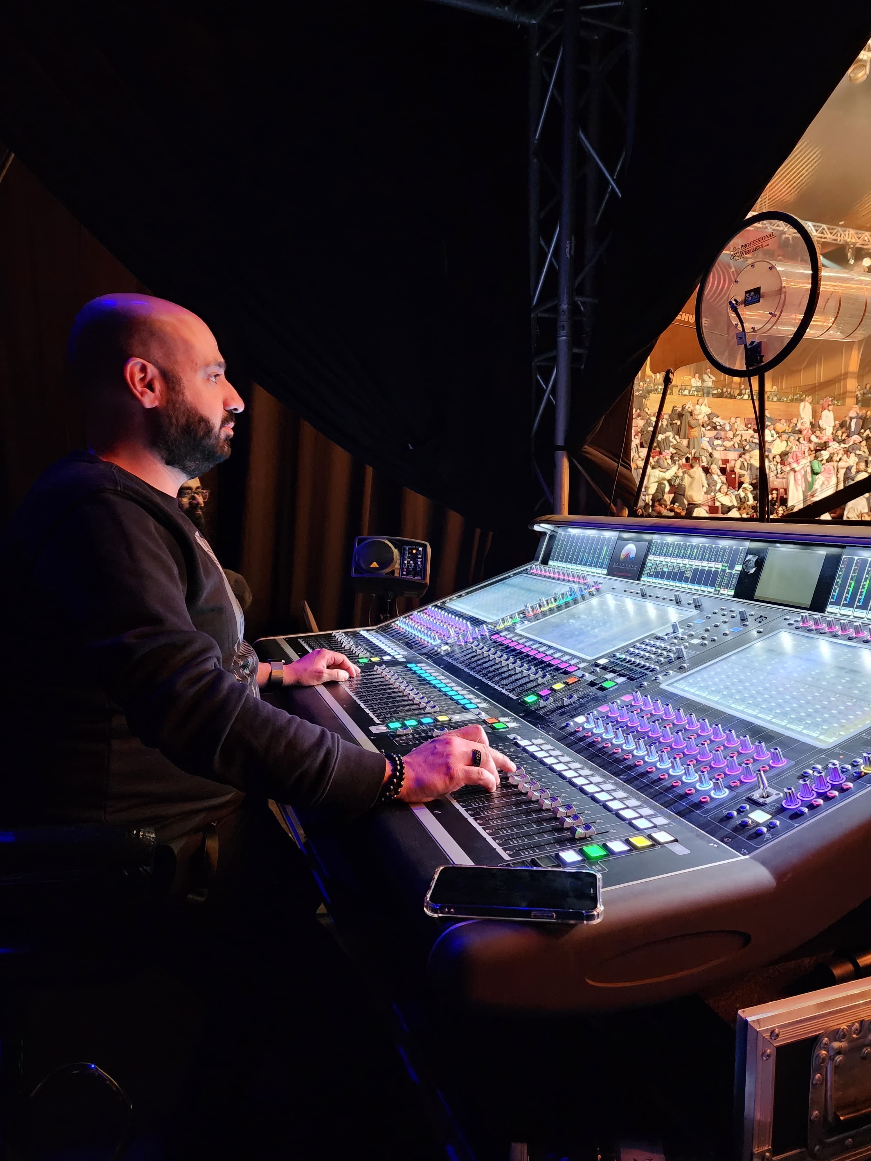 Jean-Pierre Boutros at FOH desk, indoor concert