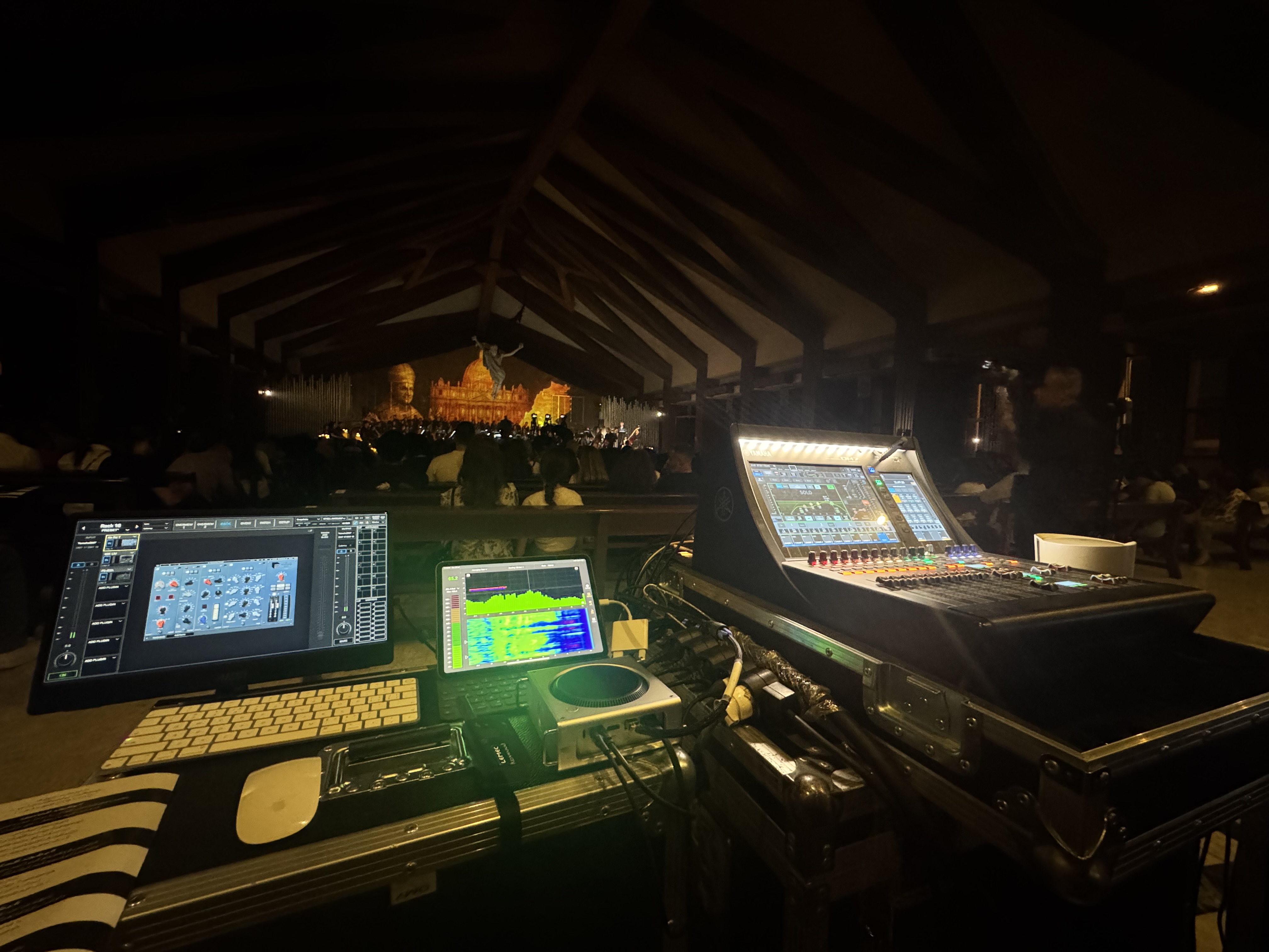 Outdoor night FOH setup with laptop and mixer