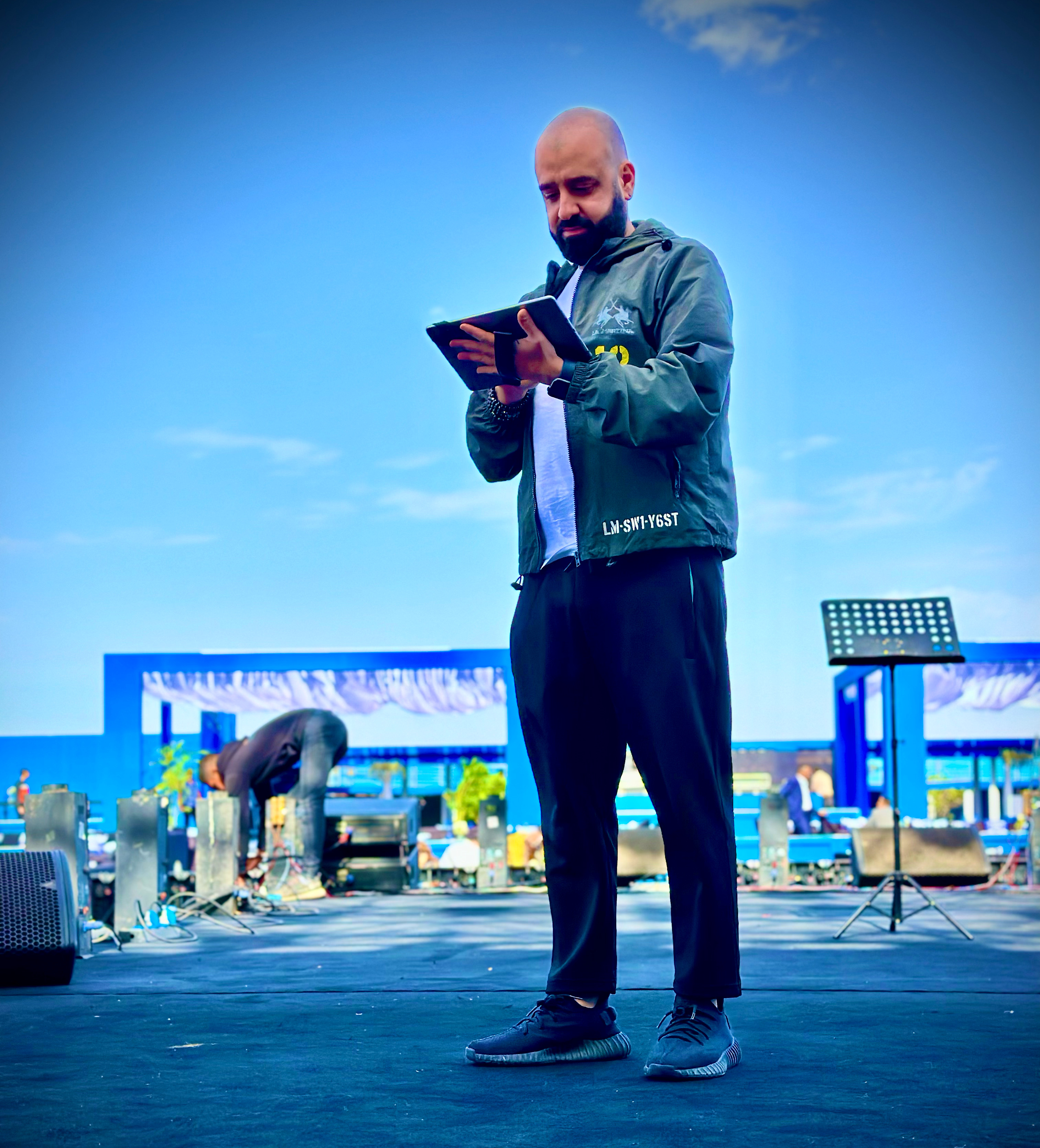 Jean-Pierre Boutros on stage at a live event
